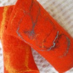 felted wrist warmers -to hide a little thought-